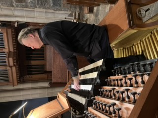Justin Bischof at an organ console